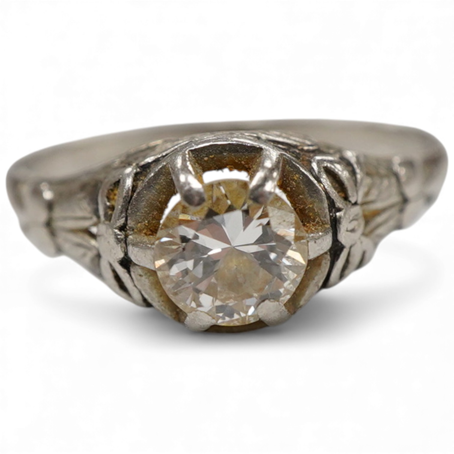 A white metal and claw set solitaire diamond ring, the stone weighing approx. 0.25ct, size N.